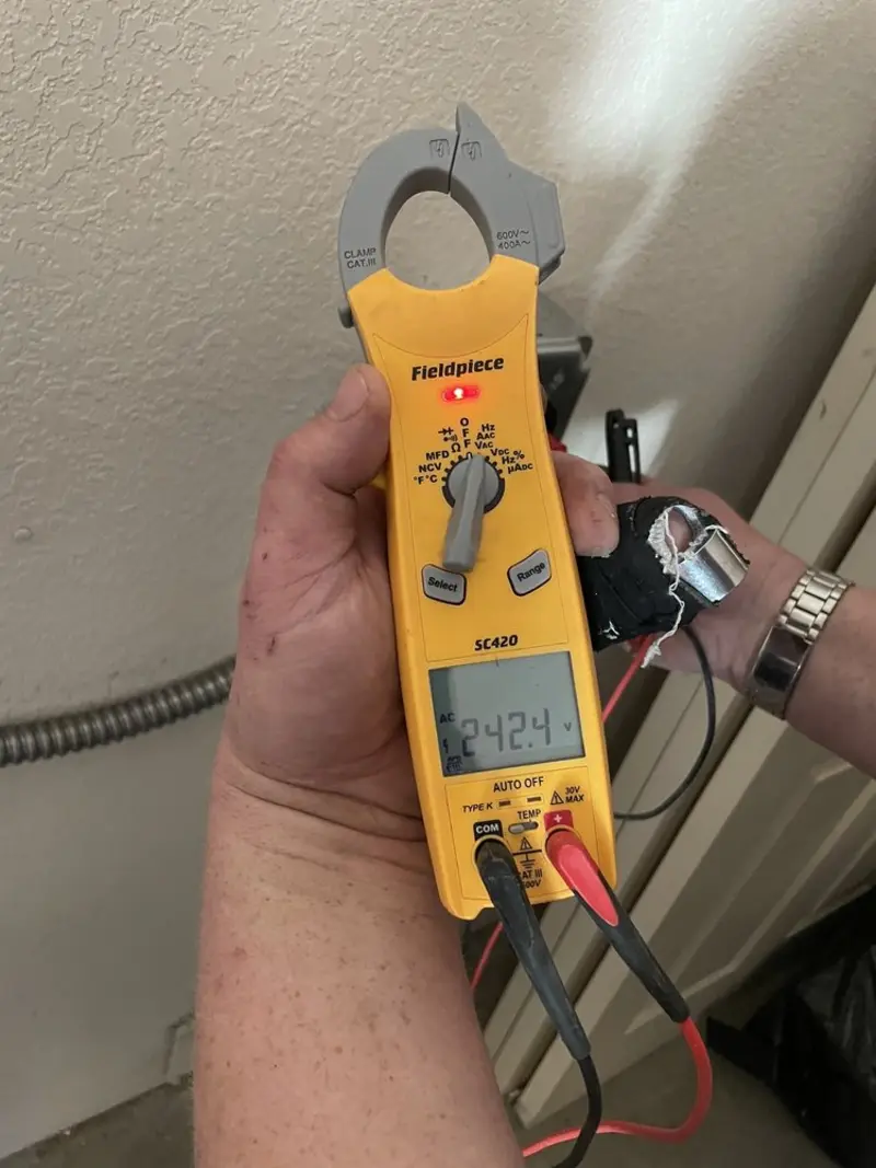 Voltage testing with clamp meter during Outlet Installation in Plover
